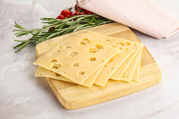 Sliced maasdam cheese with holes