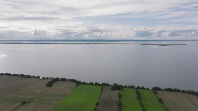 Peaceful Landscape Of Lake Vattern Overlooking Visingso Island In Sweden. Aerial Wide Shot 