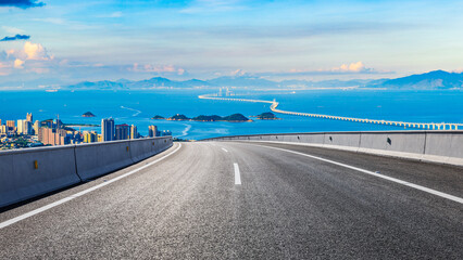 Asphalt highway and beautiful coastline natural landscape at sunset in Zhuhai. High Angle view.