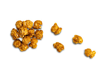 Top view pile of caramel almonds isolated on white background with clipping path.