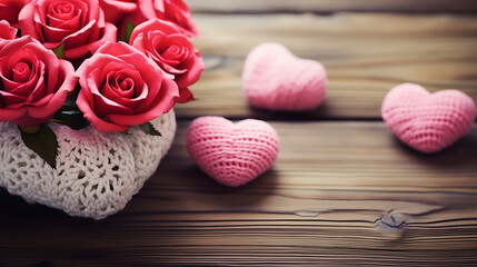Fototapeta na wymiar Valentine’s Day Roses and knitted hearts on a wooden background.