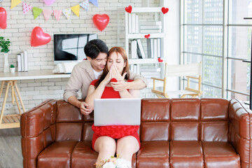 Asian young handsome male boyfriend standing smiling behind giving red wrapped present gift box...