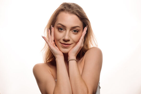 Portrait of beautiful blonde girl in beauty style with smooth clean skin on isolated white background
