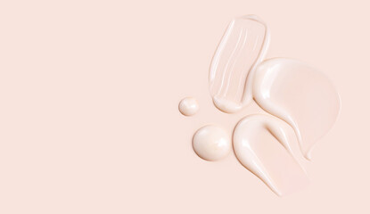 cosmetic smear texture on pastel beige background