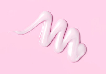 cosmetic smear cream texture on pink background