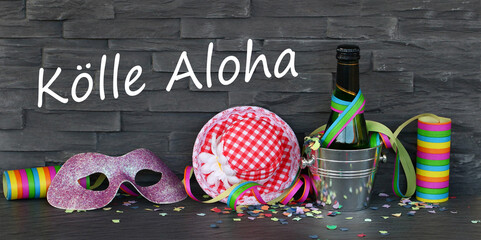 Luftschlangen,Konfetti und Karnevalszubehör mit dem Text Kölle Aloha.  Kölle Aloha  Ausruf der...