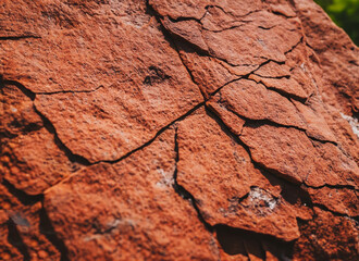 Dark red orange brown rock texture with cracks. Close-up. Rough mountain surface. Stone granite background for design , generated by AI