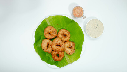 Madhu Vada, Crisp vadai meets flavorful chutney, a South Indian culinary affair that ignites the senses.