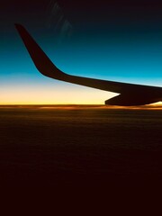 airplane wing sunrise after start