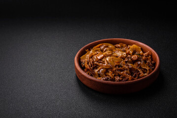 Delicious asian udon dish with vegetables, mushrooms, salt and spices