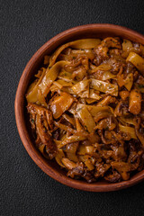 Delicious asian udon dish with vegetables, mushrooms, salt and spices