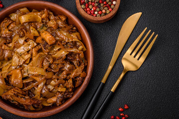 Delicious asian udon dish with vegetables, mushrooms, salt and spices