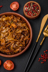 Delicious asian udon dish with vegetables, mushrooms, salt and spices
