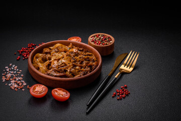 Delicious asian udon dish with vegetables, mushrooms, salt and spices