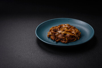 Delicious asian udon dish with vegetables, mushrooms, salt and spices