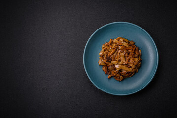 Delicious asian udon dish with vegetables, mushrooms, salt and spices