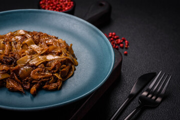 Delicious asian udon dish with vegetables, mushrooms, salt and spices