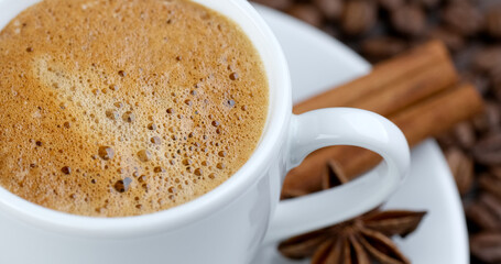Cinnamon coffee. Mixing coffee with cinnamon powder
