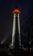 Windpoint Lighthouse illuminated by a bright red light at night