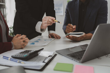 Financial accountant planner meeting business consultation introduction, Group of accountant persons talking in the office, businessperson's hand calculating invoice at workplace.