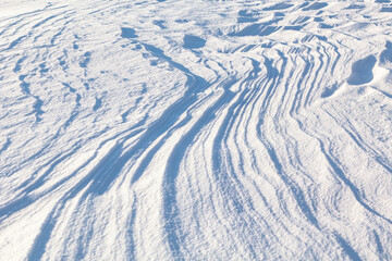 Snow drifts background . Winter natural pattern