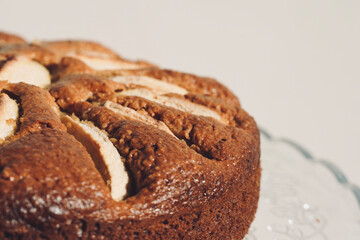 Homemade sliced fruit cake on white background. 
