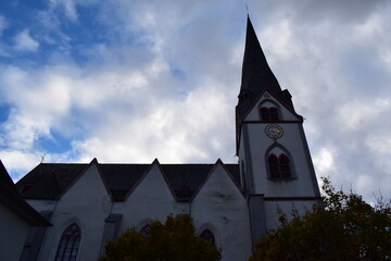Fototapeta na wymiar white church with a twisted tower