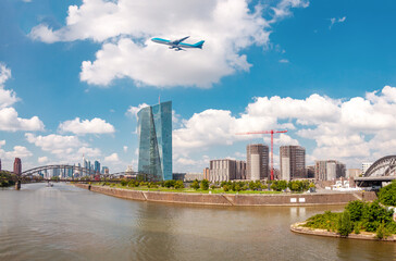 Airplane flying over the european city skyline and financial centre of Frankfurt am Main....