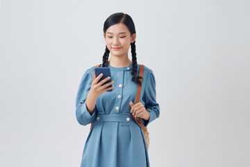  Beautiful asian lady reading message and smiling, using mobile phone