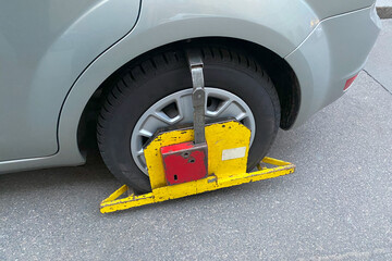 parking penalty fee or penalty. A Wheel Clamp 