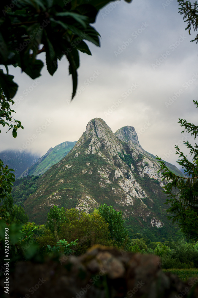 Poster Stunning landscape of Asturias, Spain with green mountains against a cloudy sky