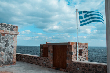 Greek flag on a lighthouse
