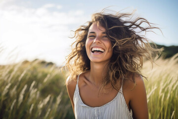 smiling woman laughing outdoors - obrazy, fototapety, plakaty