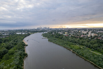 From a drone's perspective, the Vistula River in Warsaw unveils its scenic beauty, winding through...