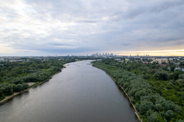 From a drone's perspective, the Vistula River in Warsaw unveils its scenic beauty, winding through...