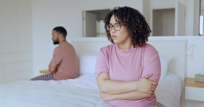 Woman, angry and fight of couple in bedroom with stress, breakup and toxic relationship at home. Frustrated partner thinking of crisis, divorce and cheating in marriage, affair and drama of conflict