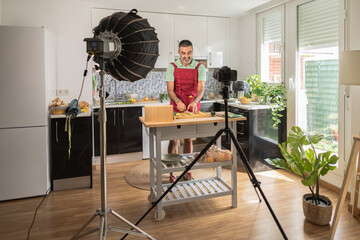adult man influencer recording streaming online cooking classes