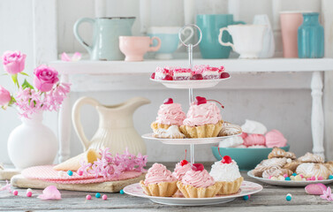 pink cakes on plate on white background