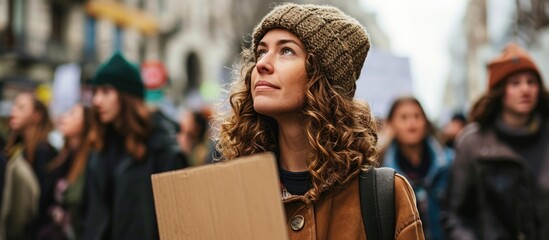 Woman holds a cardboard with a message supporting animal rights at a protest march.