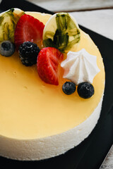 Creamy homemade lemon tart with strawberries.                 