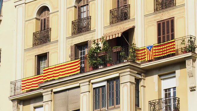 Static Medium Shot of Residential House with Several Catalan Flags Hanging