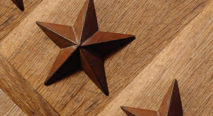 Cast iron 5 point star on a distressed oak plank 