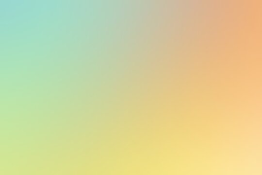 Abstract blurred background image of green, yellow, orange colors gradient used as an illustration. Designing posters or advertisements.