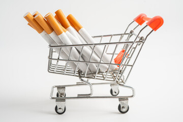 Cigarette on US dollar banknotes, cost, trading, marketing and production, No smoking, imort export concept.