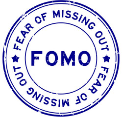 Grunge blue FOMO fear of missing out word round rubber seal stamp on white background