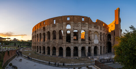Panoramic view of the Colosseum amphitheater in Rome at sunset