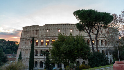 Fototapeta na wymiar Panoramic view of the Colosseum amphitheater in Rome at sunset