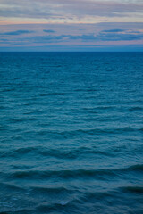 Scenic view of sea waves at sunset