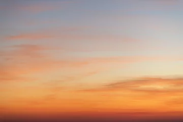 Poster Sky gradient from blue to orange sunset © EKKAPON