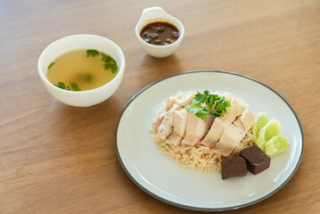 Closed up Hainanese chicken rice with soup and black soybean sauce, traditional Chinese food
